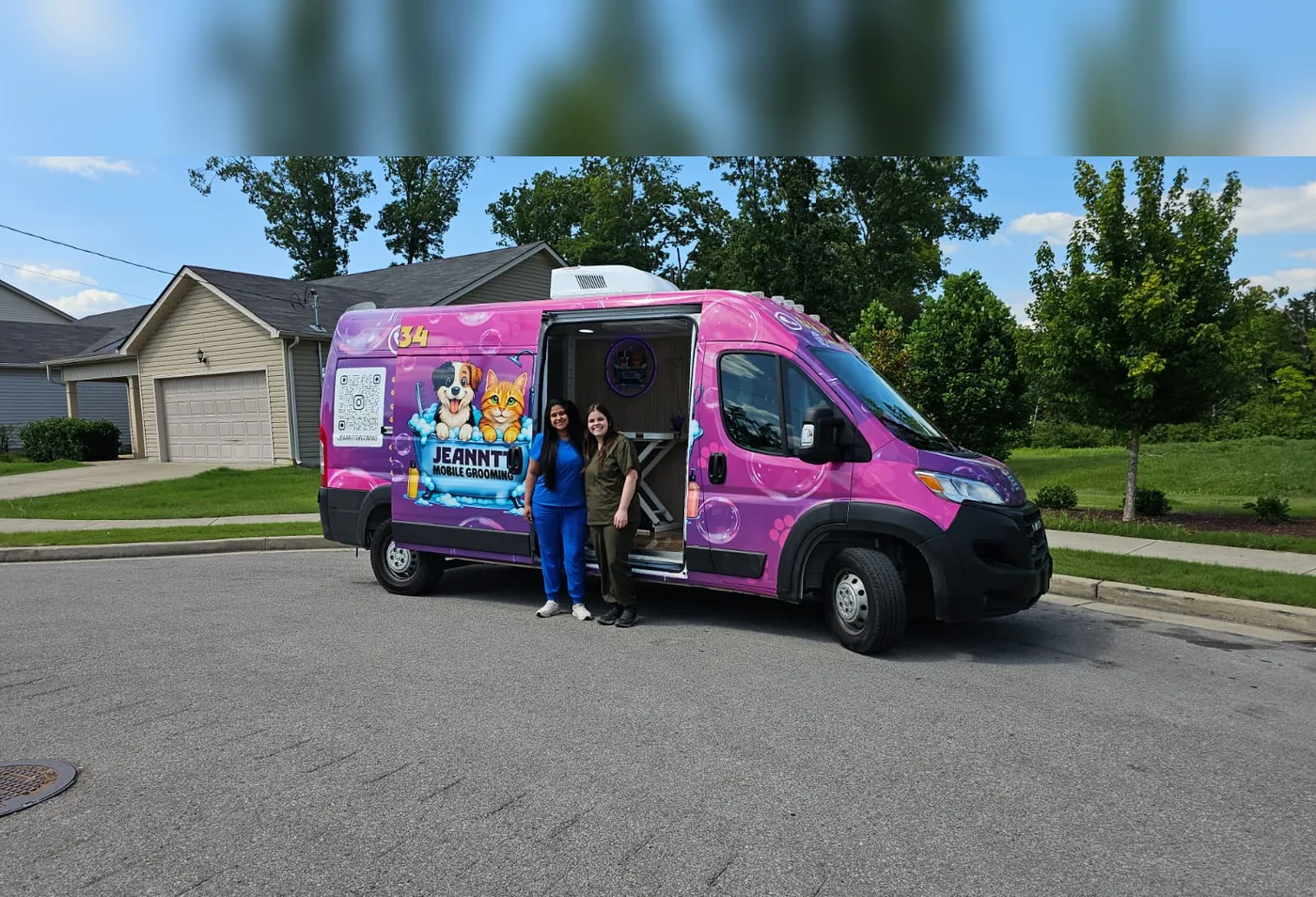 Jeanntt Mobile Grooming pink van parked at a home in Nashville